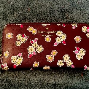 Kate spade full-size wallet. Color/burgundy